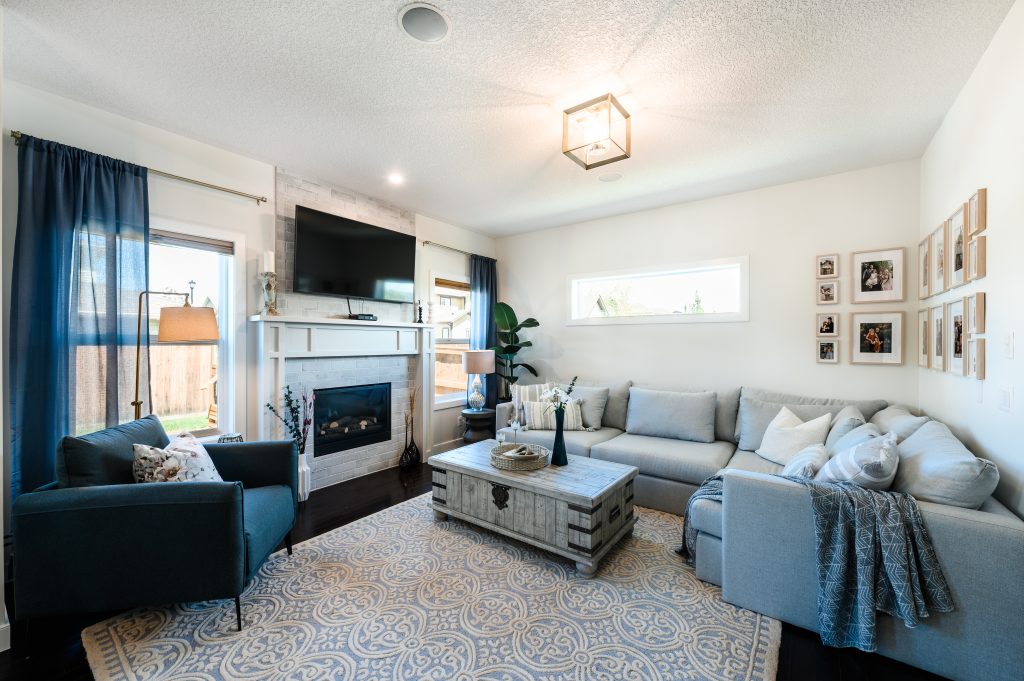 modern farmhouse cozy family room with a large corner sofa and comfy chair