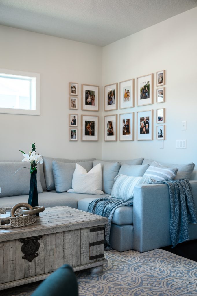 a living room gallery wall with varying sizes to fill the corner space
