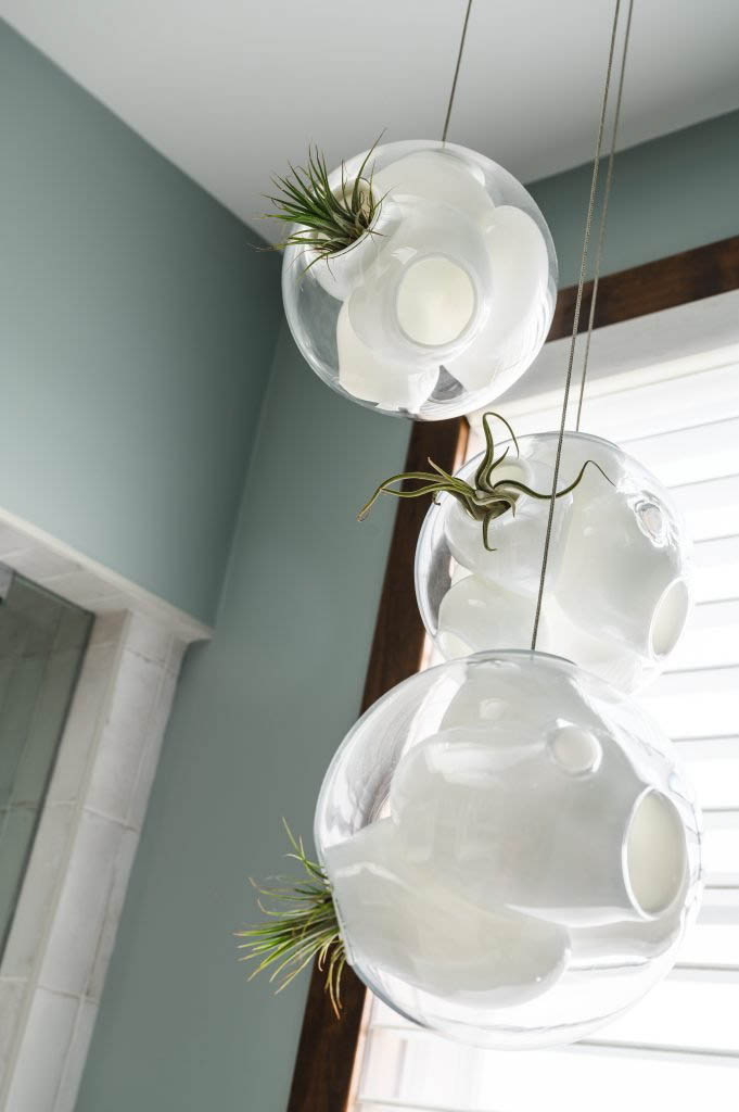 a 3-piece varying heights chandelier for over a bathtub for that spa and nature feeling