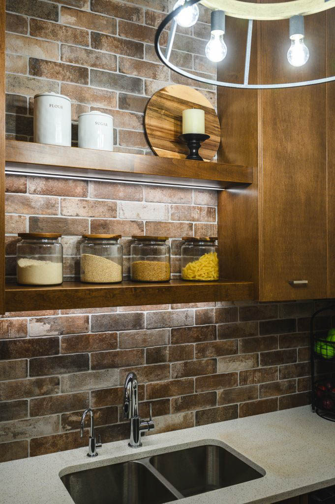 a butlers pantry designed with floating shelves perfectly decorated with food storage and a cutting board