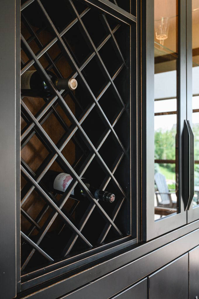 a black display cabinet with a built in wine rack