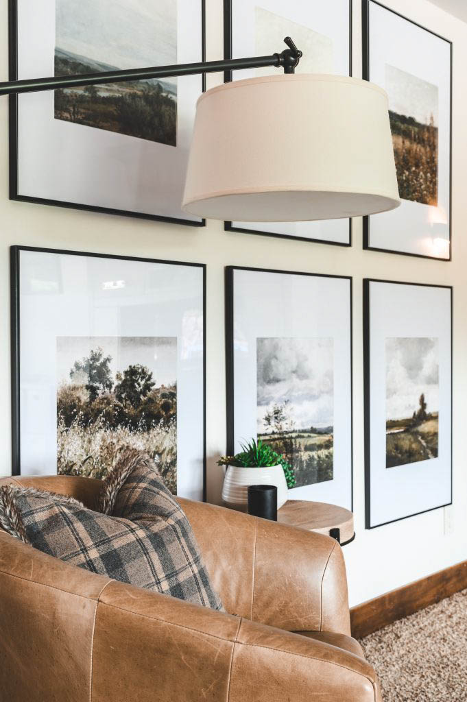 a lamp overhead this reading chair chosen for its cream lampshade and black hardware to match the frames