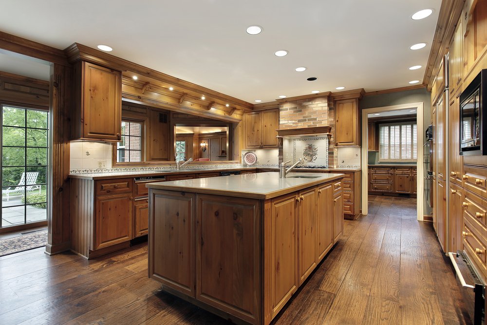 Traditional kitchen in luxury home with oak wood cabinetry