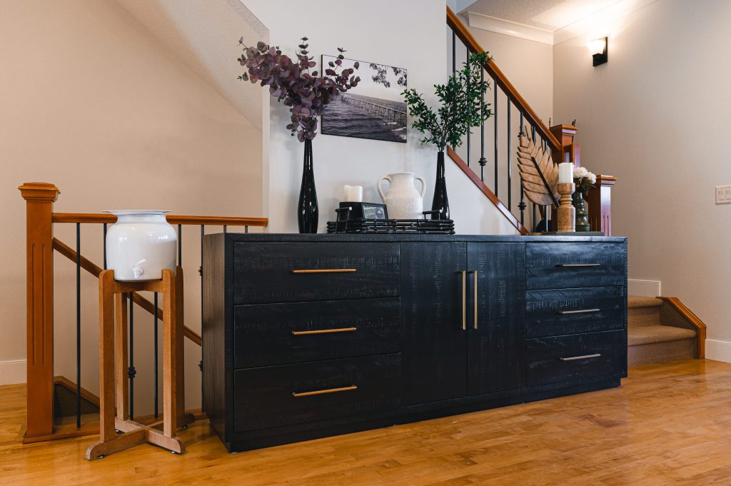 Cozy luxury killarney home interior decorating Entry Way console table styling unshelf design. Large black console table with cabinets for extra hidden storage.