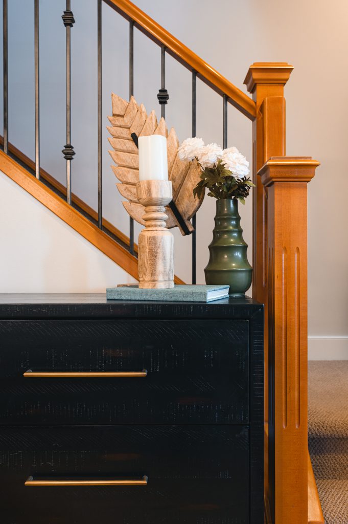 Cozy luxury killarney home interior decorating Entry Way decor unshelf design. Black console table styled with vase and candle decor.