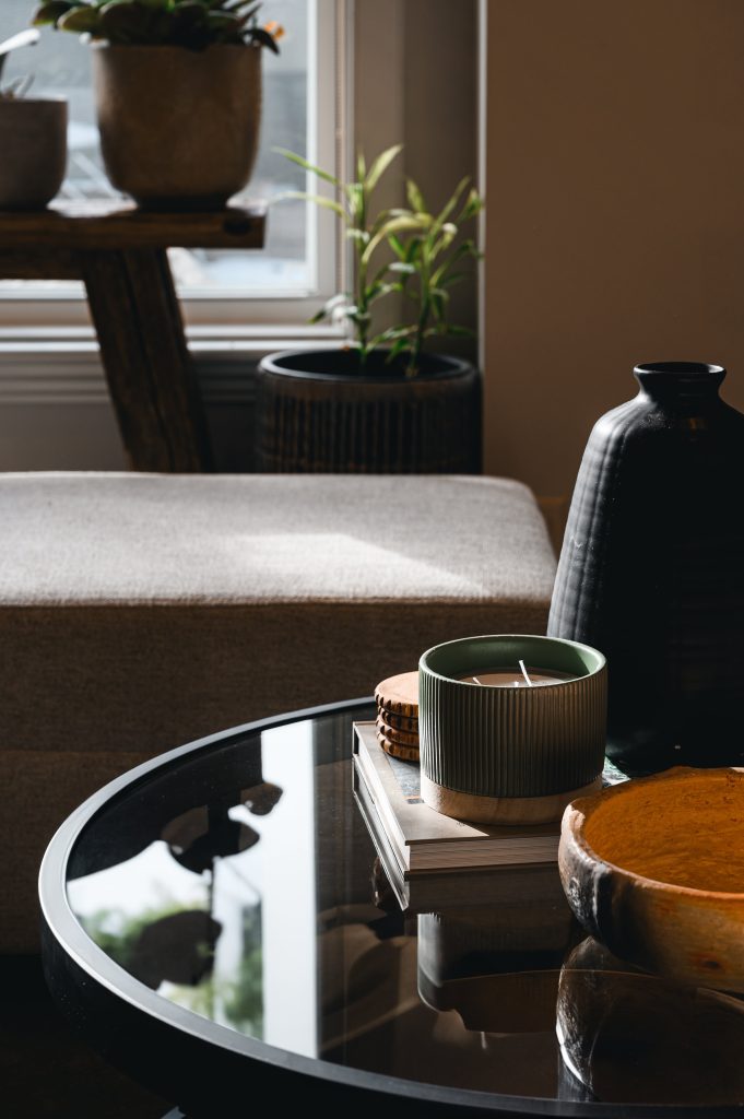 Cozy luxury killarney home interior decorating Living Room detail tray unshelf design. Glass tray in living room style with a candle and modern decor.