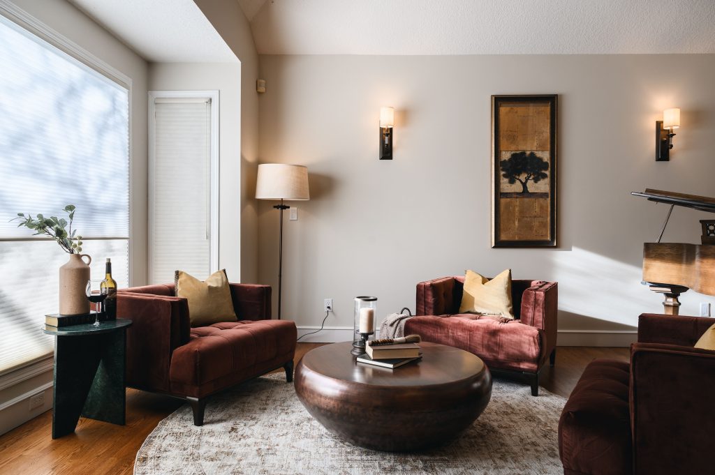 Tuscany Estate Interior Decorating Sitting Room Coffee Table Unshelf Design. Living room with burgundy chairs and yellow cushions.