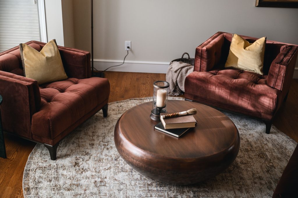 Tuscany Estate Interior Decorating Sitting Room Yellow Pillows Unshelf Design. Large tufted burgundy chairs.