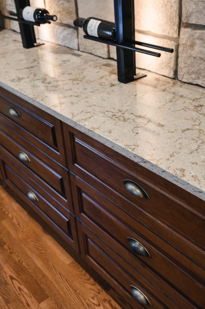 Tuscany Estate Interior Decorating Wine Tasting Room Countertop Detail Unshelf Design. Neutral quartz countertop with neutral stone colour on the wall.