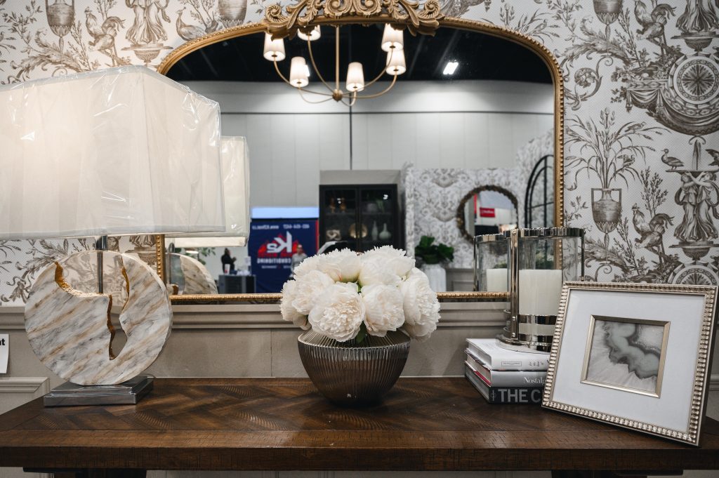 Renovation Show Stately Room Interior Decorating Stately Details of Console Table Unshelf Design. Wood console table styled with a textured vase and a marble table lamp.