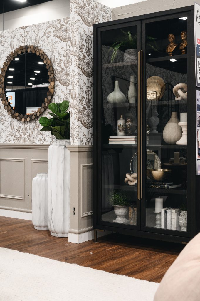 Renovation Show Stately Room Interior Decorating Stately Living Room Large Bookcase Unshelf Design. Wainscotting in a light beige colour underneath a modern wallpaper.