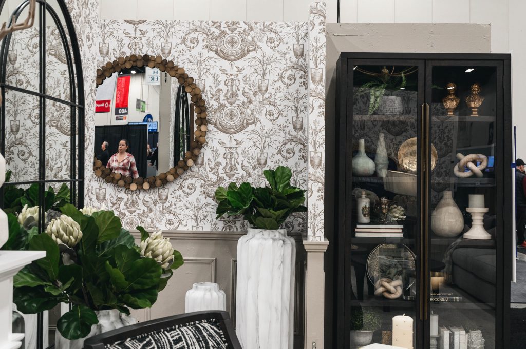 Renovation Show Stately Room Interior Decorating Stately Living Room Large Planter Unshelf Design. Large wood mirror on a large scale patterned wallpaper.
