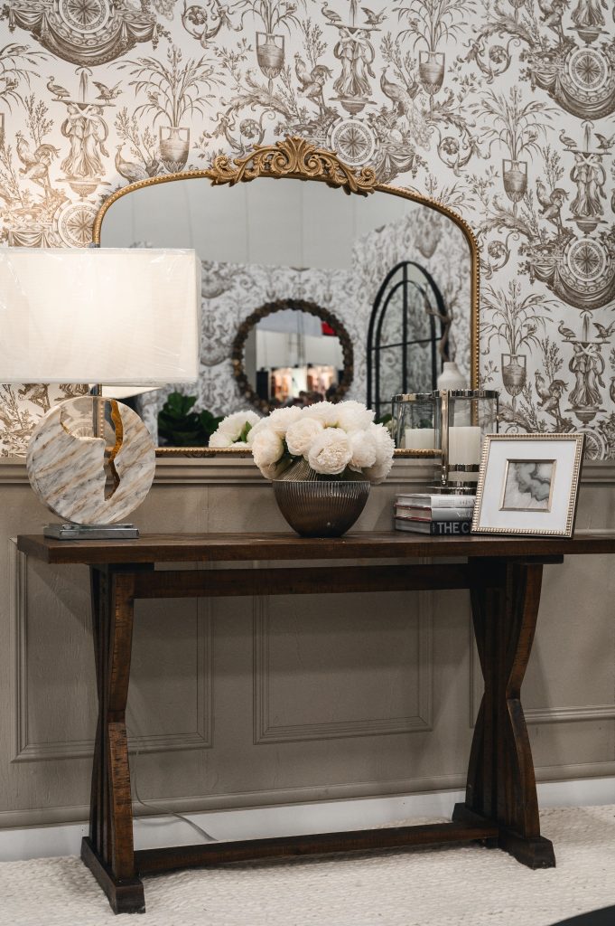 Renovation Show Stately Room Interior Decorating Stately Living Room Modern Console Table Unshelf Design. Large wood console table in front of a traditional brass mirror.