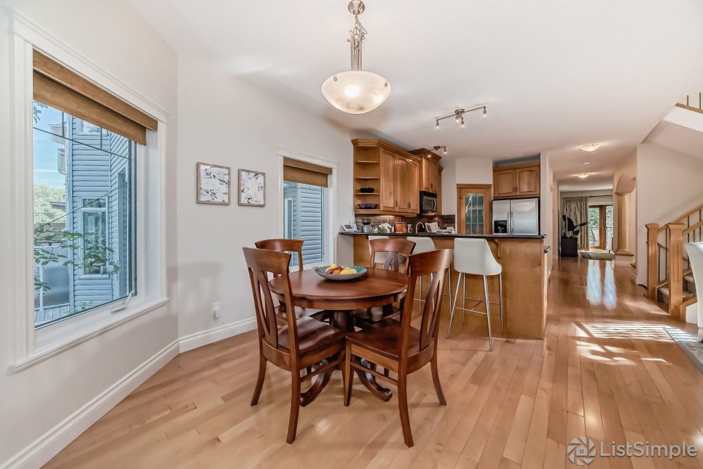 Transitional Inglewood Home Home Staging Kitchen and Breakfast Nook Wood Chairs Unshelf Design. Wood table styled with a decorative tray holding fruit.