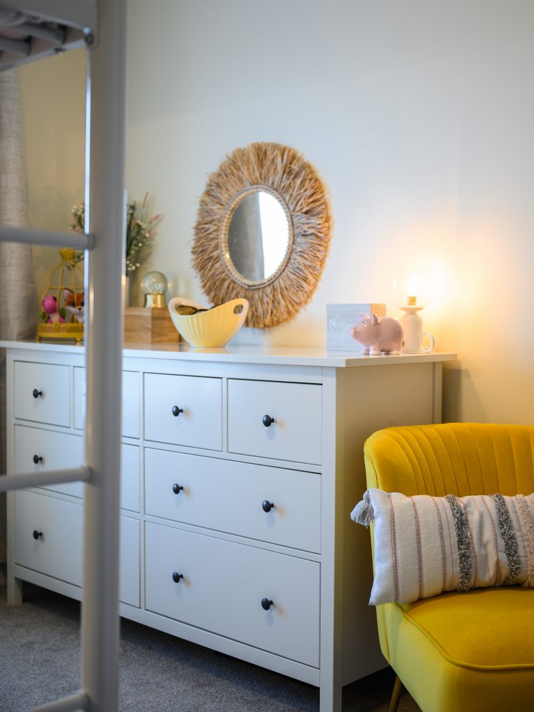 yellow lounge chair in bedroom