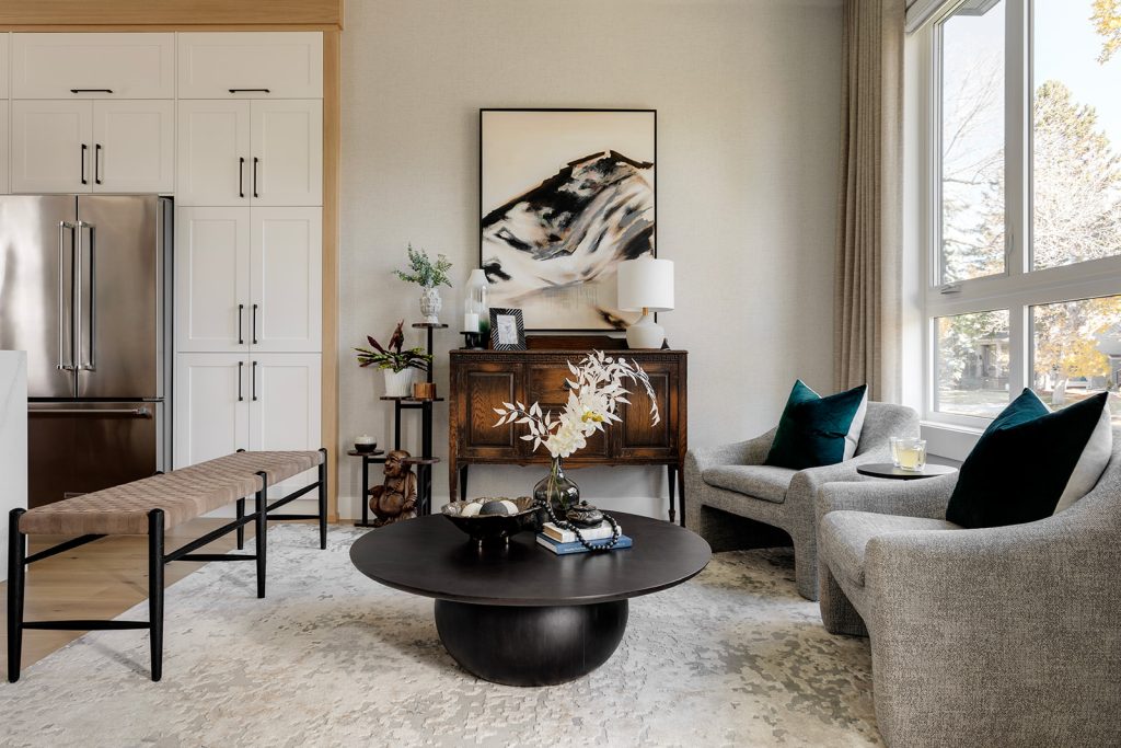 Side angle photo of a dark wood dining room table. Five dining chairs surround the table, with bench seating on one of the longer sides. Modern mountain design interior furnishing & decorating dark dining room table Unshelf Design