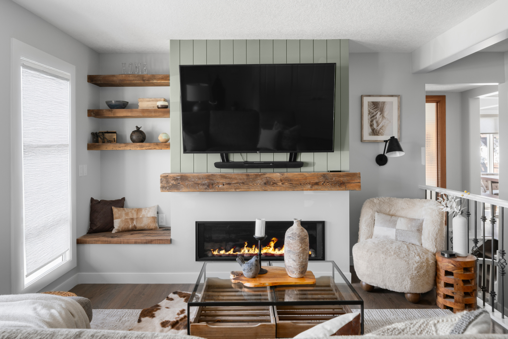 a living room styled with dark burnt orange, brown and gorgeous artwork