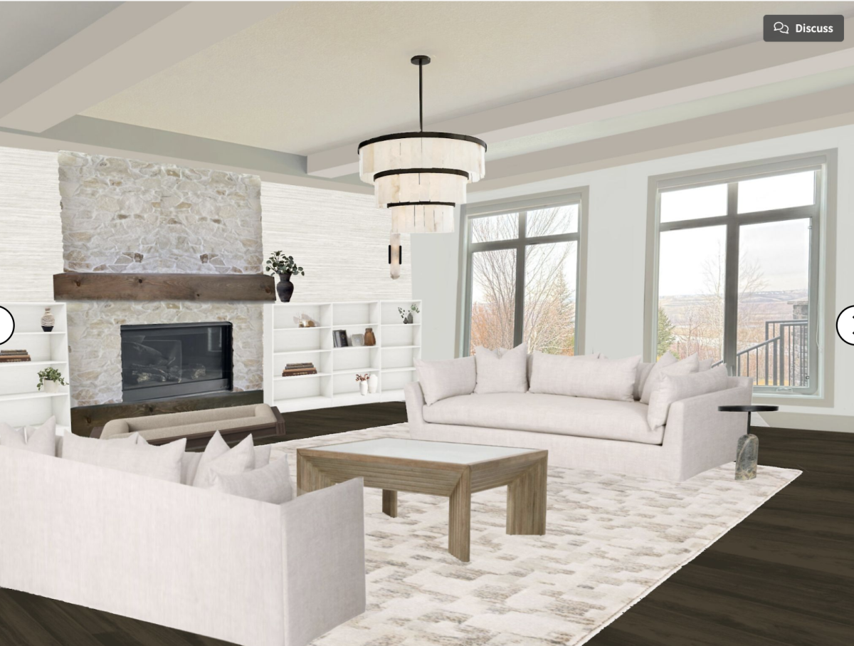 a living room styled with dark burnt orange, brown and gorgeous artwork