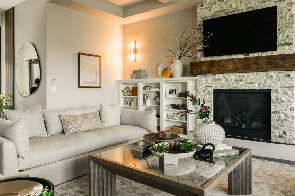 a living room styled with dark burnt orange, brown and gorgeous artwork