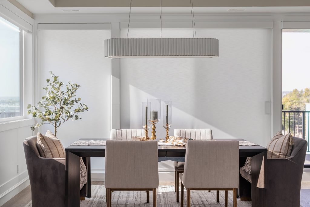 a bright modern kitchen with gorgeous tiled flooring to reflect the natural light. staged with a shimmering vase and sage