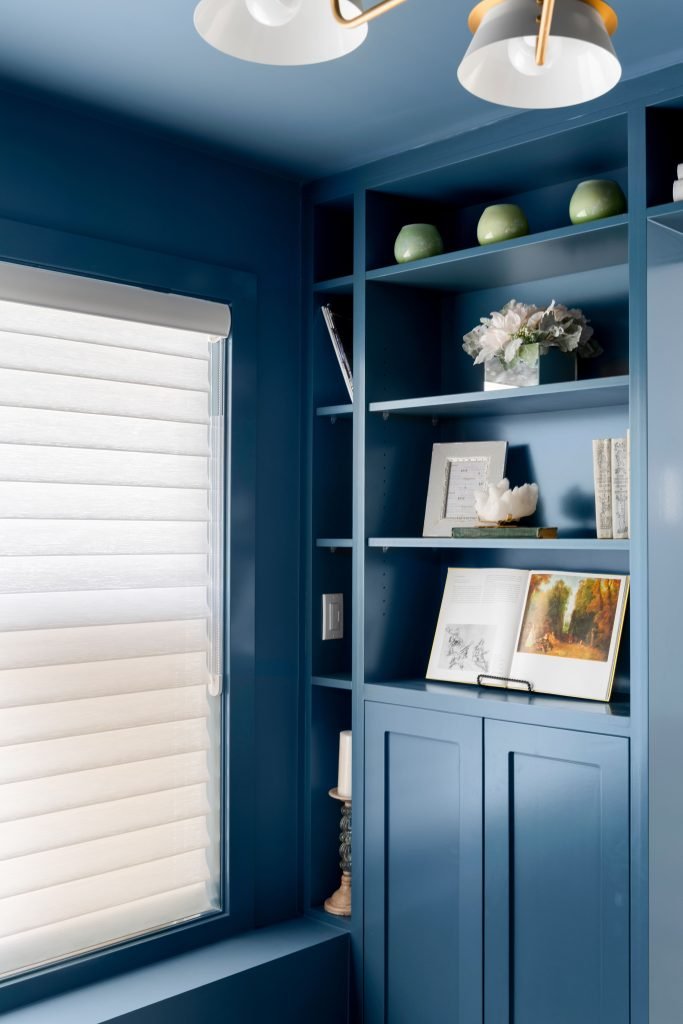 basement wellness space build out interior design and furnishing custom shelving home library unshelf design