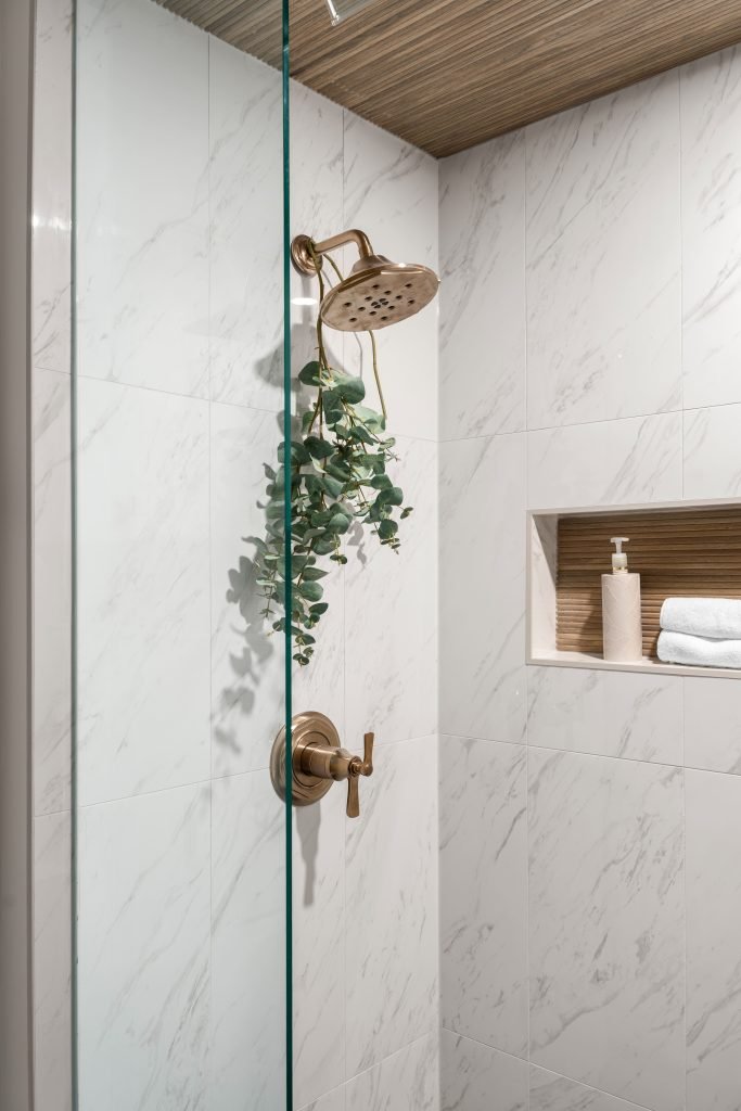basement wellness space build out interior design and furnishing luxe gold shower fixture unshelf design